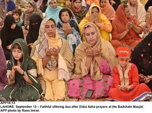 APP16-13 LAHORE: September 13  Faithful offering dua after Eidul Azha prayers at the Badshahi Masjid. APP photo by Rana Imran