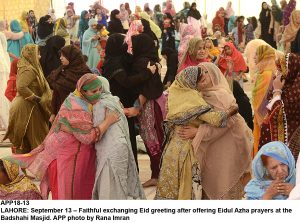 APP18-13 LAHORE: September 13  Faithful exchanging Eid greeting after offering Eidul Azha prayers at the Badshahi Masjid. APP photo by Rana Imran