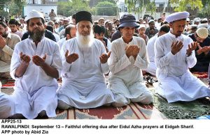 APP25-13 RAWALPINDI: September 13  Faithful offering dua after Eidul Azha prayers at Eidgah Sharif. APP photo by Abid Zia