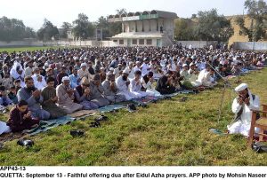 APP43-13 QUETTA: September 13 - Faithful offering dua after Eidul Azha prayers. APP photo by Mohsin Naseer