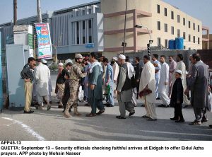 APP45-13 QUETTA: September 13  Security officials checking faithful arrives at Eidgah to offer Eidul Azha prayers. APP photo by Mohsin Naseer