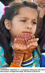 APP50-13 HYDERABAD: September 13  A young girl offering dua after Eidul Azha prayers at Eidgah Rani Bagh. APP photo by Akram Ali